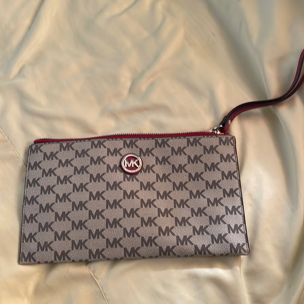 Michael Kors clutch or wristlet purse.  Brown with red trim.